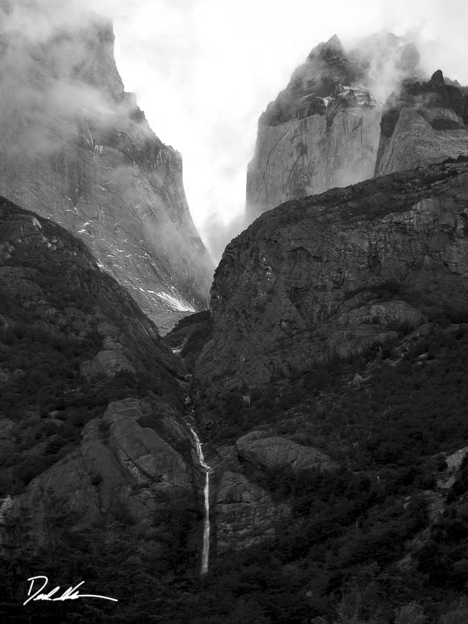 Waterfall through mountain valley
