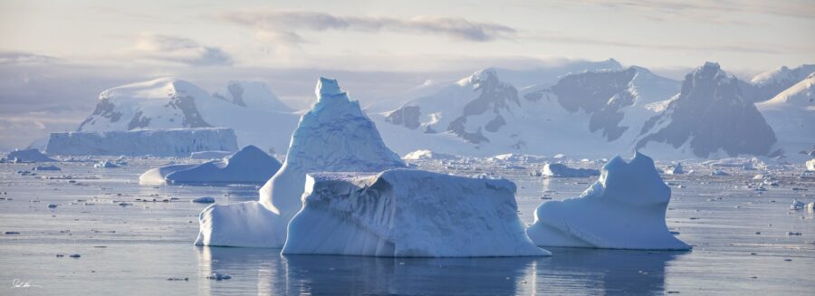 sunrise on mountains and icebergs in Antarctica