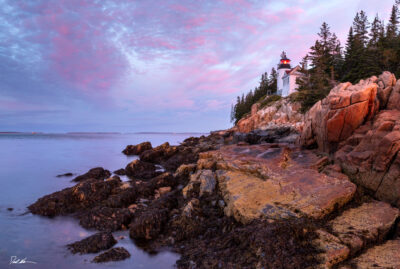 image of Bass Harbor Lighthouse in Acadia National Park at sunrise with purple skies