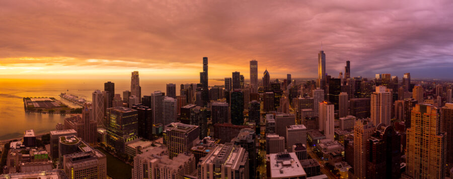 panoramic image of Chicago during a colorful sunrise taken high above the city