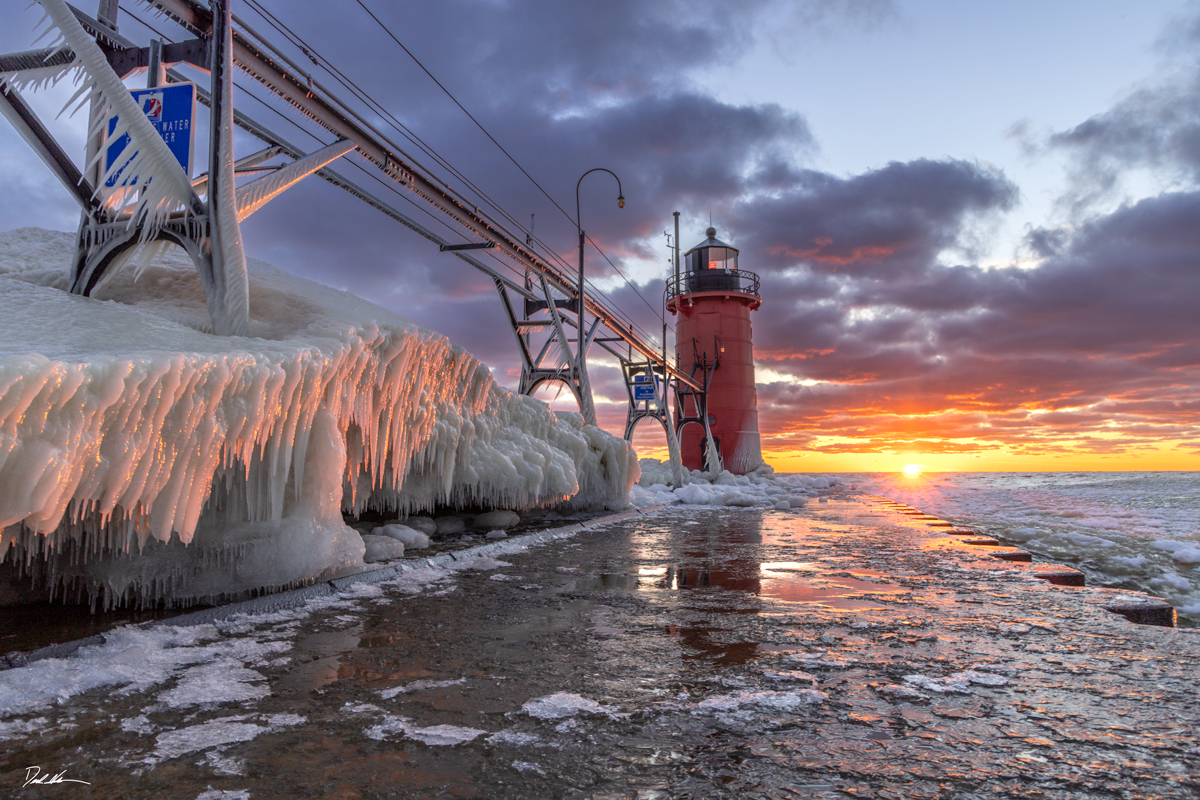 South Haven Lighthouse at sunset with ice