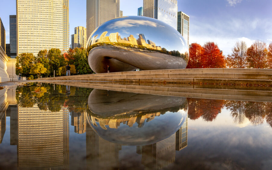 image of a reflection of The Bean or Cloud gate in a puddle during fall 