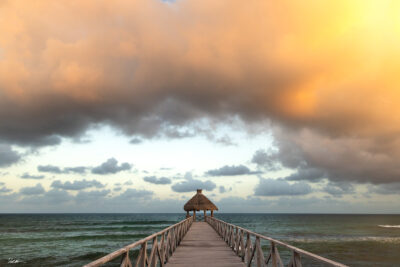 ocean view clouds over dock in Cancun