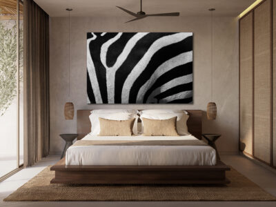 Large unframed abstract image of a zebra taken close up displayed in the bedroom of a luxury modern home