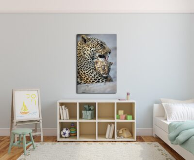 large fine art print of a mother leopard bathing her cub displayed in a child's nursery