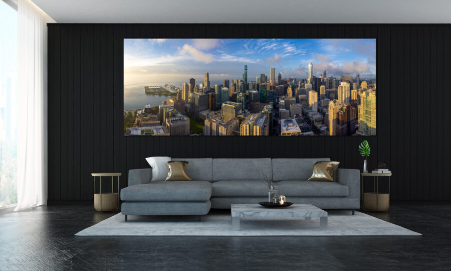Large panoramic print of Chicago from high above the city displayed in the living room of a modern home