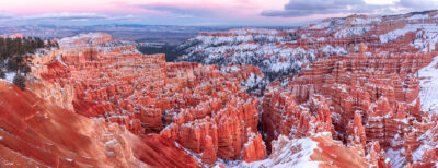 beautiful photo of Bryce Canyon at sunset with snow inside the canyon
