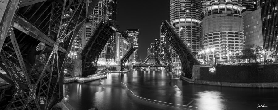 large panoramic black and white image of the Chicago River with all the bridges up during the pandemic and George Floyd race riots. 