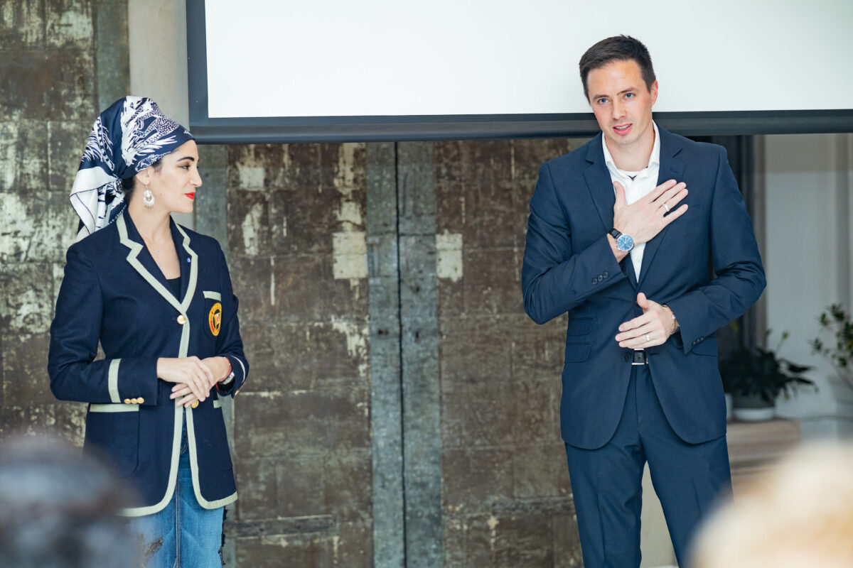 Photograph of National Geographic wildlife veterinarian Dr. Gabby Wild with award-winning nature photographer Derek Nielsen giving a presentation in New York City