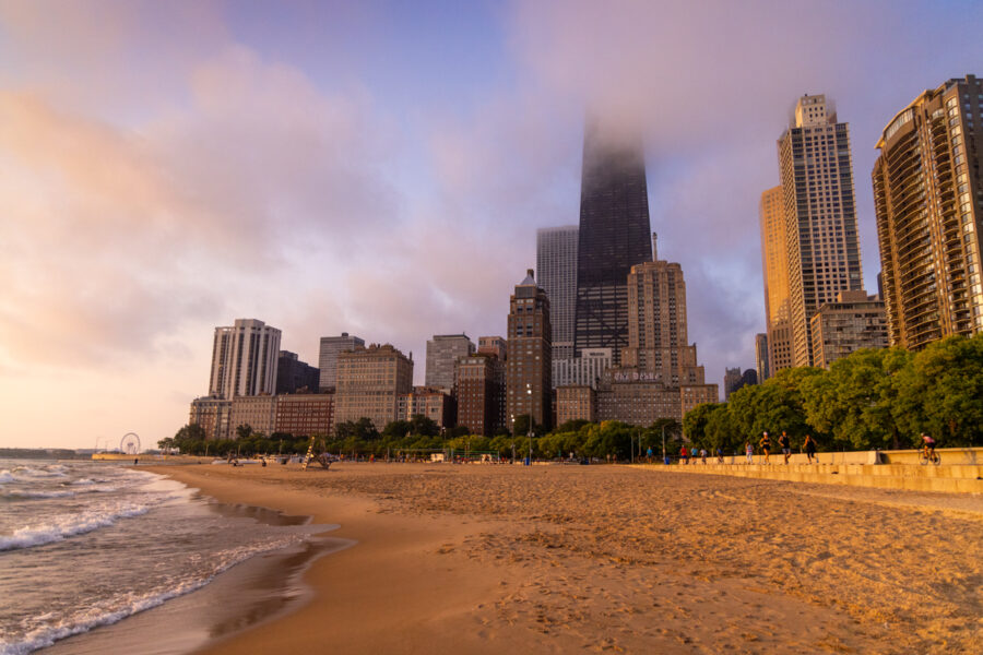 image of the city of chicago taken from Oak Street beach at sunrise