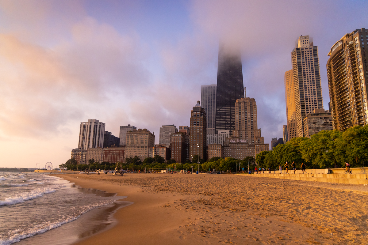 image of the city of chicago taken from Oak Street beach at sunrise