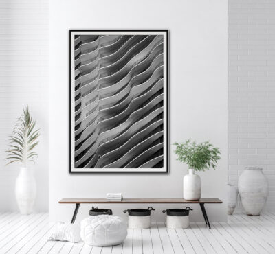 Framed abstract fine art black and white print of the Aqua building in Chicago displayed in the entry of clean modern home