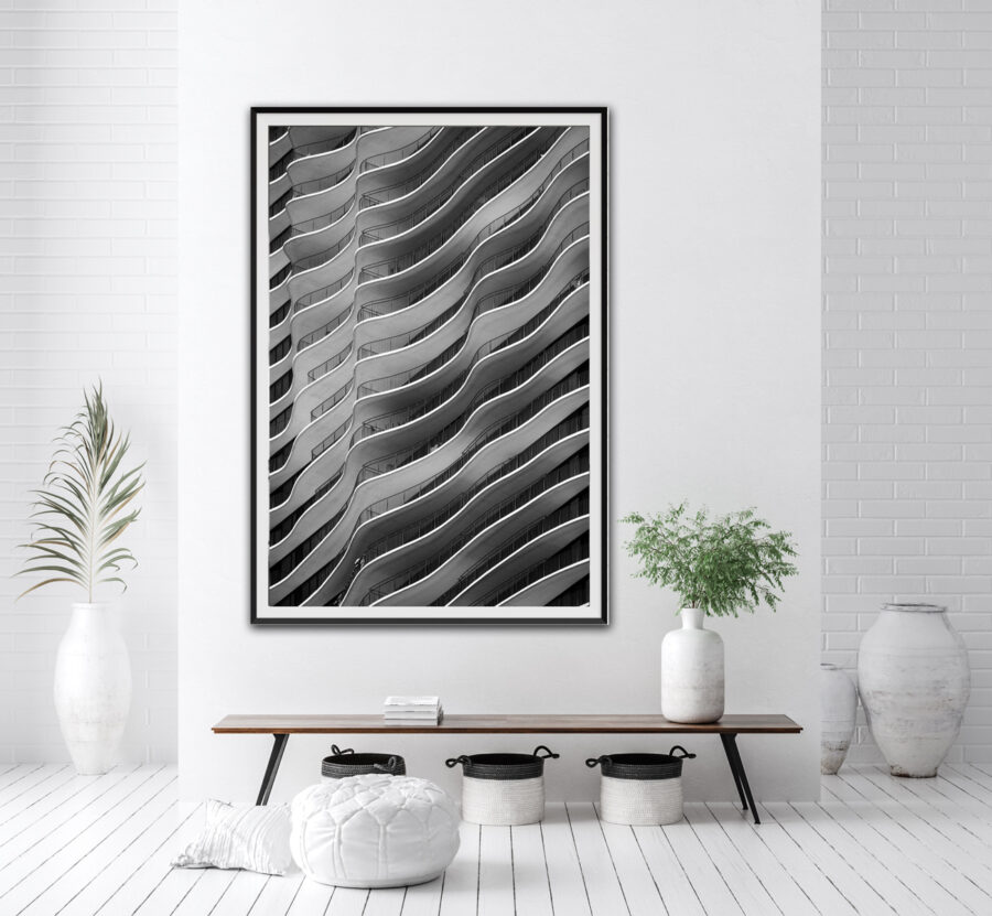 Framed abstract fine art black and white print of the Aqua building in Chicago displayed in the entry of clean, modern home from photographer Derek Nielsen's Chicago photography prints