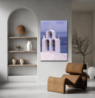 Unframed lumachrome fine art print of a bell tower in Santorini Greece displayed in the living room of a southwest home