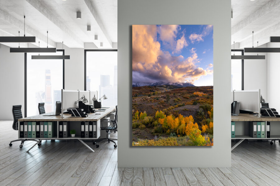 very large unframed fine art print of the Dallas Divide in Colorado during sunset displayed in an office setting