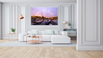 Large unframed fine art print of sailboats under a rainbow in Friday Harbor displayed in the living room of a luxury home