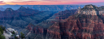 large panoramic image of the Grand Canyon during sunset with deep rich colors