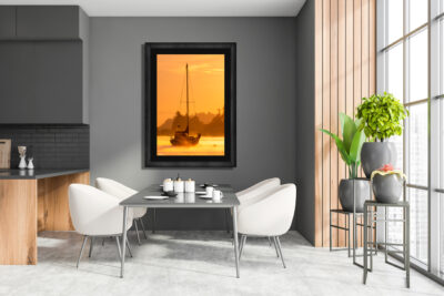 large framed fine art print of Langley Harbor in Washington displayed in the dining room of a modern apartment