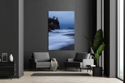 Large unframed fine art print of Ruby Beach in Olympic National Park during a storm displayed in the living room of a modern home