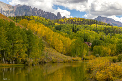 image of a beautiful mountain cabin on a lake in Telluride Colorado with fall colors