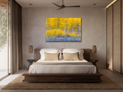 unframed image of a deer standing in front of aspen trees in Telluride, Colorado, displayed in the bedroom of a luxury home