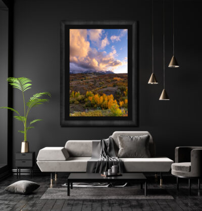 Large framed fine art photo of the Dallas Divide in Colorado during fall at sunset displayed in the living room of a luxury home