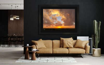 large framed fine art print of a farm taken at sunset displayed in the living room of a luxury modern country home