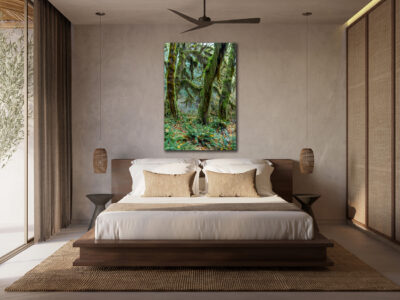 large unframed print of moss covering trees in the Olympic National Park displayed in the bedroom of a luxury home
