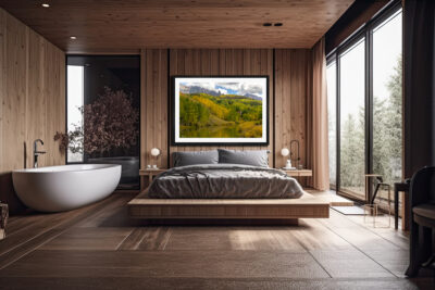 large framed fine art print of mountain scene during fall displayed in the bedroom of a five star hotel