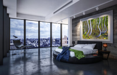 very large framed fine art print of twisting aspen trees in Telluride Colorado displayed above the bed in a luxury condo