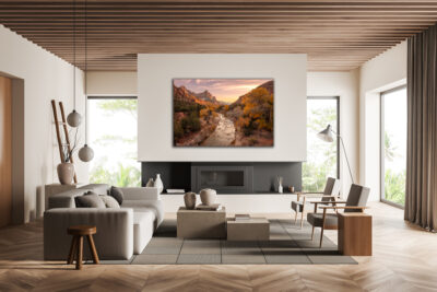 large unframed print of the Watchman in Zion National Park displayed above the fireplace of a modern home