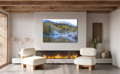 Large unframed fine art print of a wintery fall scene in the mountains around Telluride displayed in the living room of a modern luxury home