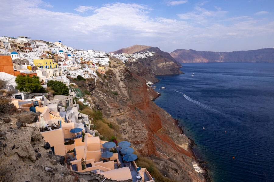 image of Santorini Island with colorful cliffs leading down the ocean