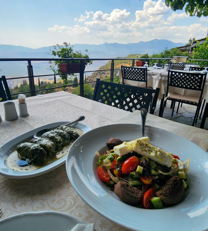 image of delicious Greek food in the town of Delphi looking over the valley below with mountains in the background