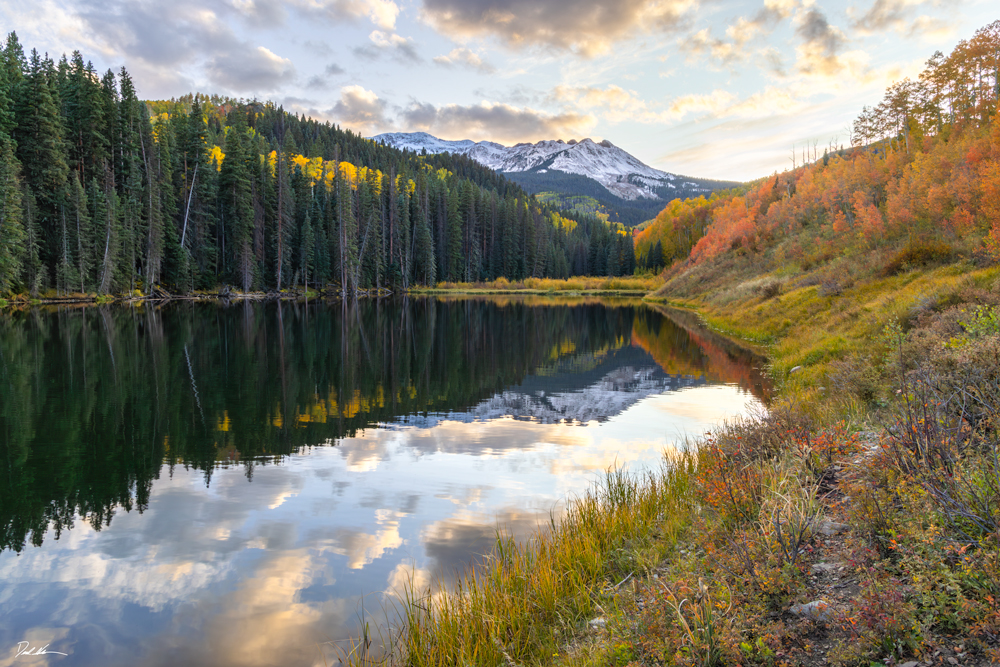 Landscape image of Woods Lake in Telluride, Colorado taken during sunset with fall colors on the mountain