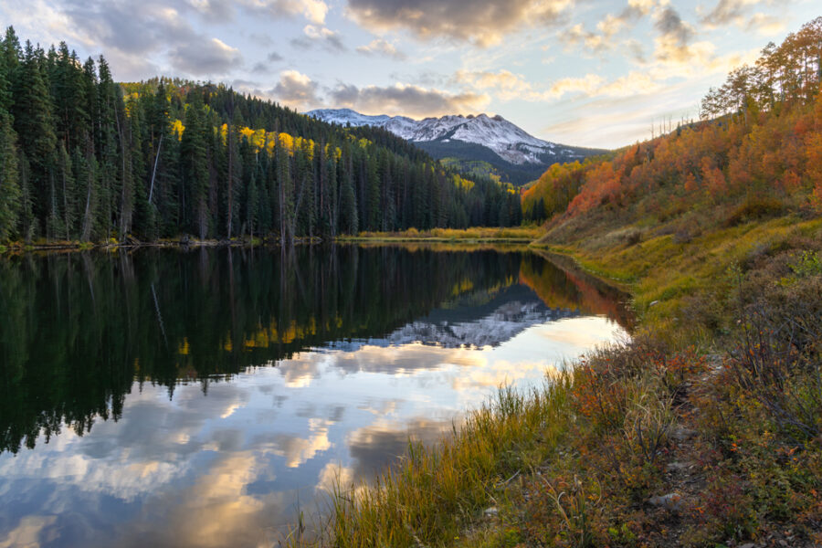 Landscape image of Woods Lake in Telluride, Colorado taken during sunset with fall colors on the mountain