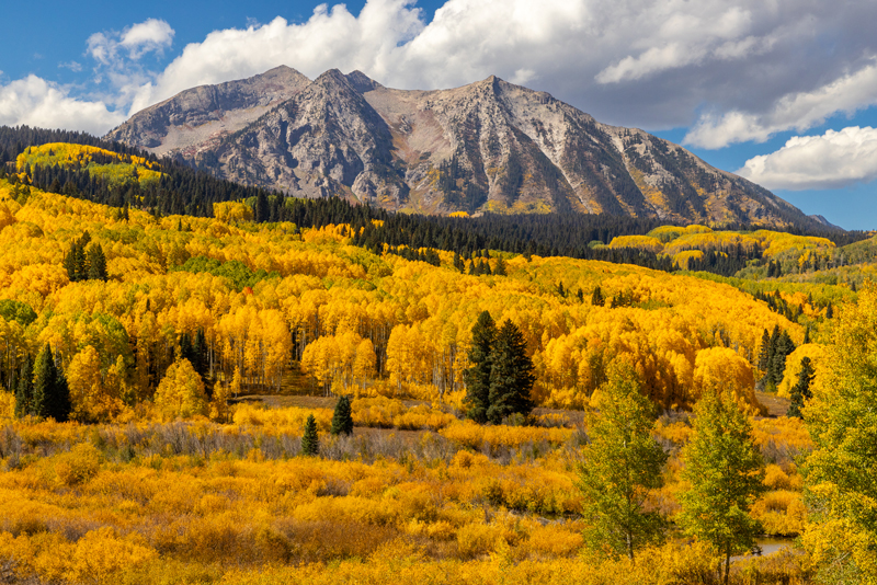 Image of a beautiful mountain scene with gorgeous fall colors decorating the landscape