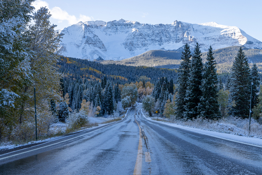 photo of a snowy winter road in the mountains of Colorado outside of Telluride
