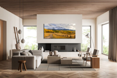 large landscape fine art print of Wilson Peak in Telluride Colorado displayed above a fire place in a modern luxury mountain home