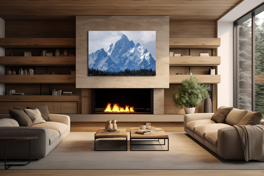 Large fine art photograph of the Teton mountains displayed above a fire place in a modern mountain cabin