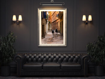 Beautiful framed fine art print of two Spanish women walking down the narrow streets of Barcelona displayed in the waiting are of a luxury restaurant
