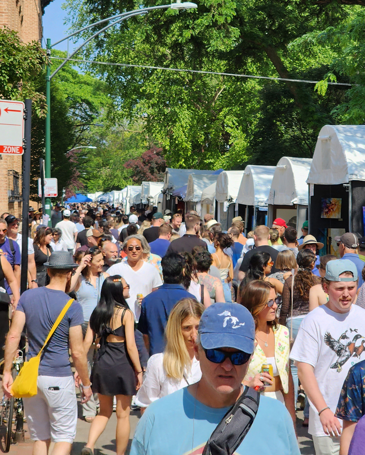 Image of art collectors walking through a crowded Old Town Art Fair in Chicago 