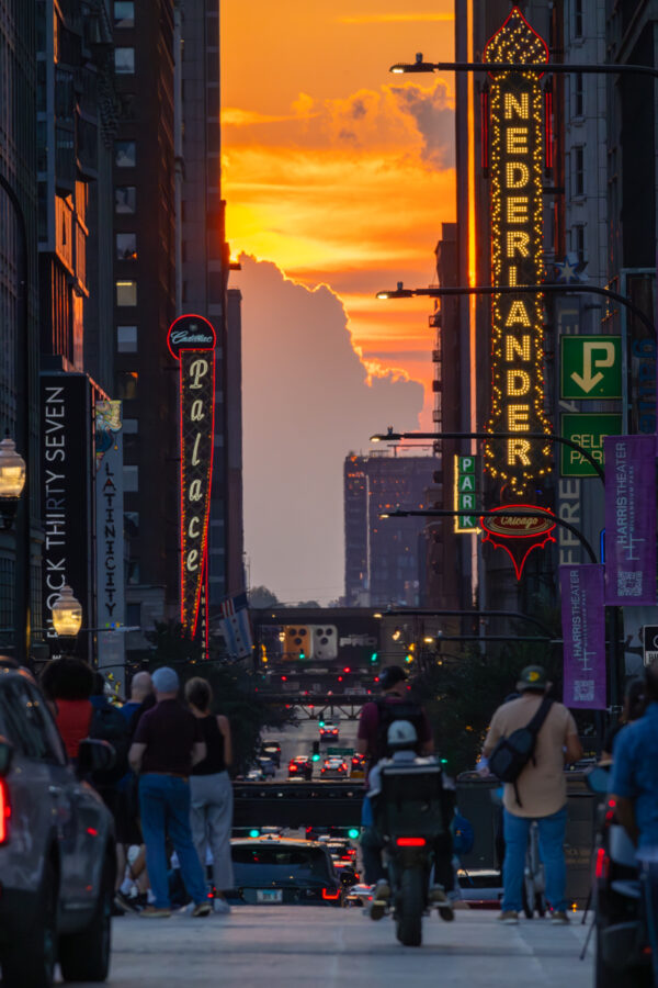 Photograph of Randolph Street in Chicago during the fall henge when the sun sets directly east and west on Chicago's grid