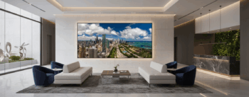 A very large luxury fine art print of chicago being used in the lobby of a modern luxury hotel