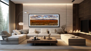 Extra large fine art print of the grand tetons during fall displayed in the living room of a mountain mansion