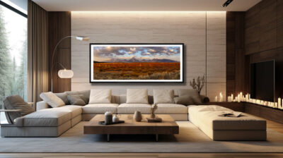 Extra large fine art print of the grand tetons during fall displayed in the living room of a mountain mansion