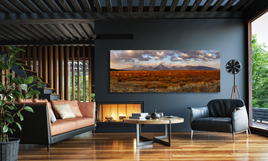 Large unframed fine art photographic print of the grand teton national park range displayed in the living room of a modern mountain house