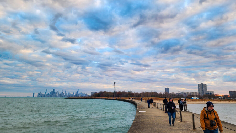 Photograph of people on Montrose Pier in Chicago looking for snowy owls