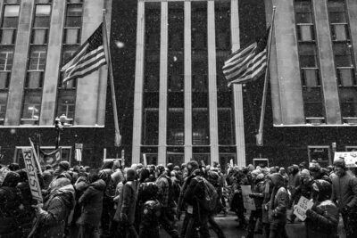 fine art photo of people protesting in the streets of chicago in the snow
