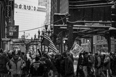 photograph of protesters in chicago marching in the snow